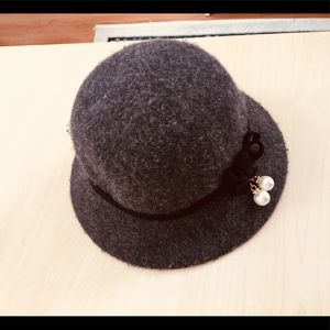 Boutique wool hat with adjustment ties
